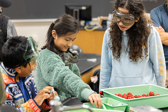 Kids doing science experiment during Free College Week.