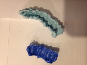 The top is [insert name] which will be used to cast the full arch while beneath is the [insert name], a.k.a. "the blue goo," which will be used to cast a small section of teeth.