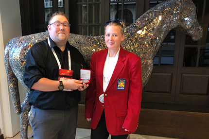 WCC student Ashlea Carravallah (right) poses with instructor Bobby Feldkamp and her SkillsUSA silver medal.