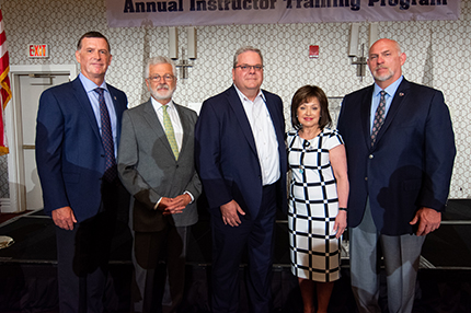 WCC President Dr. Rose B. Bellanca stands with Ironworkers representatives (from left) Lee Worley, Victor Cornellier, Eric Dean and Ed Abbott.